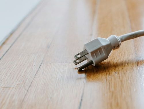 A plug outlet on the floor